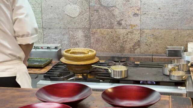 Japanese Omakase Chef Cooking with Donabe Pot in Commercial Kitchen