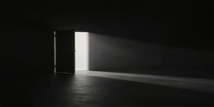 A lone man stands in a dark concrete corridor of an empty office building illuminated by a sliver of light coming through an open door at the end of the long hall