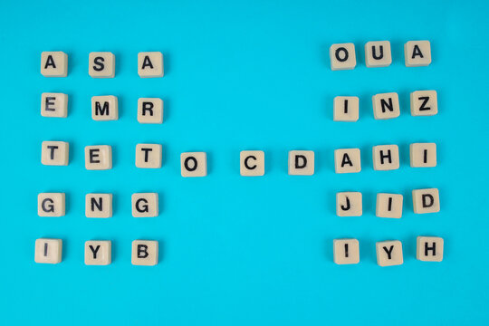 Top View Of OCD Word In Tiles Centered Between Symmetrical Letter Grids For Mental Health Concept