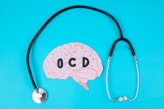Top View Of Paper Brain With OCD Text And Stethoscope For Mental Health Concept