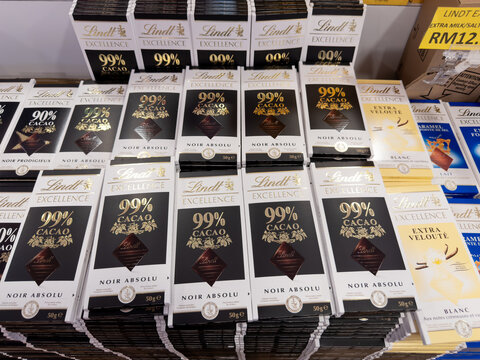 KEDAH, MALAYSIA - MAR 18, 2026: Lindt Excellence 99% cacao dark chocolate bars displayed on retail store shelf.