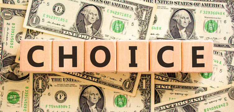 Choice symbol. Concept word Choice on beautiful wooden blocks. Beautiful dollar bills background. Beautiful dollar bills. Business choice concept. Copy space.