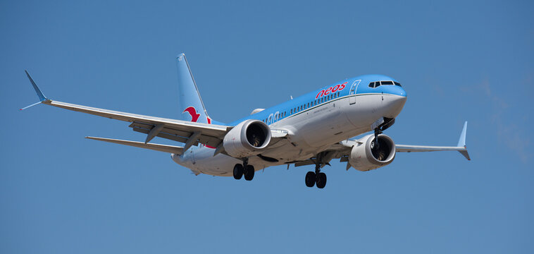 Tenerife, Spain April 27st, 2026. Boeing 737 MAX 8 Neos Airlines flies in the blue sky. Landing at Tenerife Airport