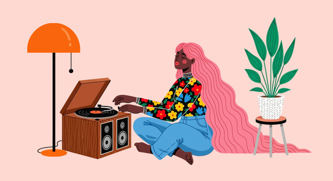 Woman enjoying music on a vintage record player in a cozy room with plants and a lamp