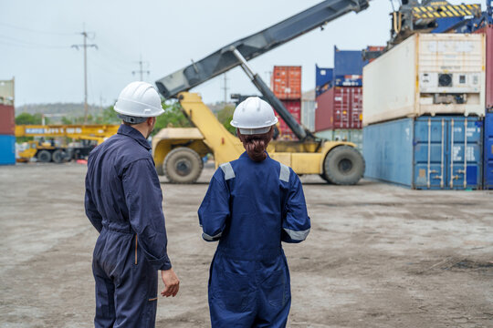 Diverse Male and Female Logistics Workers Observing Port Operations