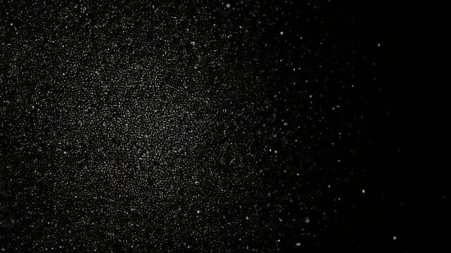 暗闇に揺らめく粒子ノイズの抽象テクスチャ背景