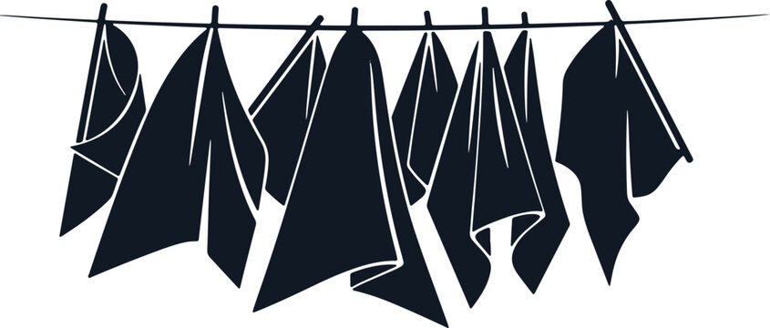 Group of dark blue clothes hanging on clothesline outdoors in daylight.