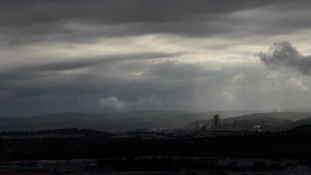 Gloomy Industrial Cement Plant Panorama Under Heavy Cloudy Sky