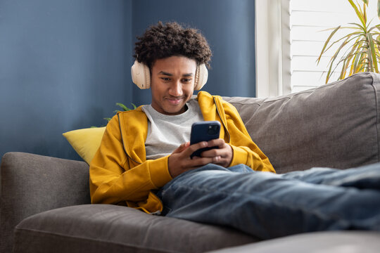 Teenage boy Listening to Music on his smartphone
