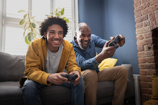 Father and son playing a video game together