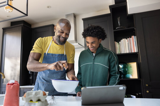 Father and Son Baking Together in the Kitchen