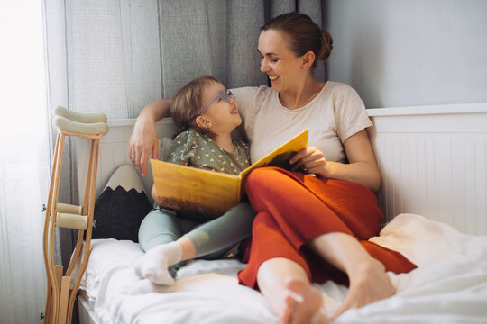 Mother and child enjoying story time at home