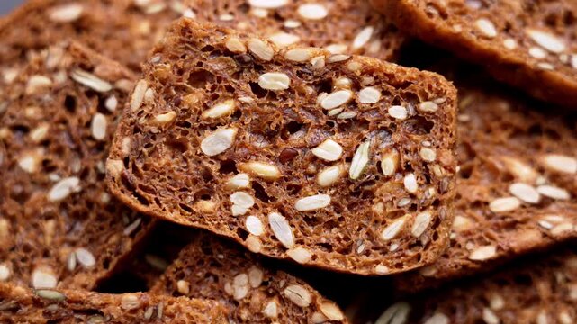 Close up of multigrain gluten free crispbread with seeds. Healthy high fiber product made from mixed cereals and plant based ingredients