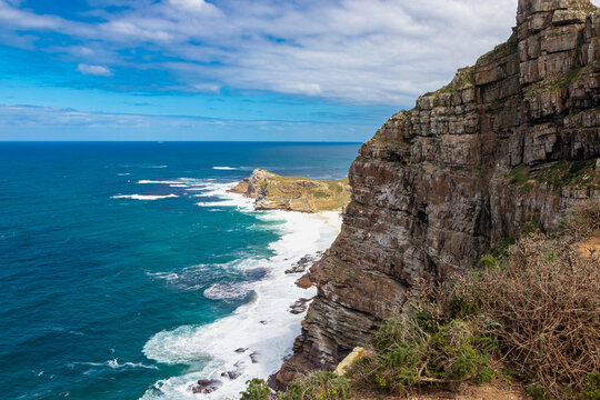 Cape Point is a promontory at the southeast corner of the Cape Peninsula, a mountainous and scenic landform with rugged rocks and sheer cliffs towering more than 200 metres above the sea and cutting d
