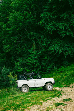 4x4 SUV parked on mountain trail