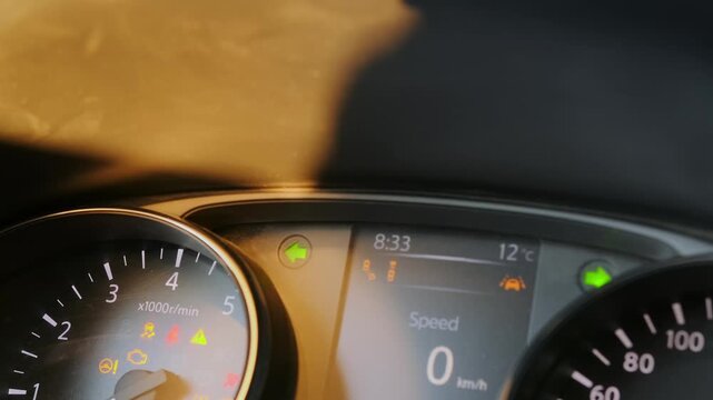 car dashboard warning indicators close-up shot showing hazard lights and arrow signals flashing on instrument panel, driving safety alerts inside vehicle for transport control and monitoring
