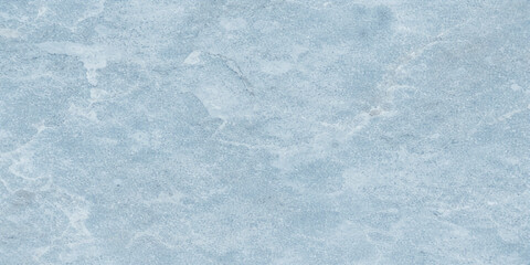 A bright winter abstract background featuring a blue marble texture with white frost patterns and frozen snow on a closeup window surface © RD Visuals