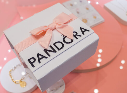 Braunschweig, Germany - March 28, 2026: Elegant jewelry present box Pandora on a retail display. Luxury branding, fashion shopping concepts, and premium gift packaging themes.