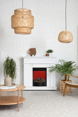 Naklejka premium Interior of living room with modern fireplace, table and houseplants
