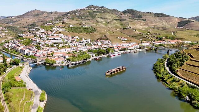 Scenic douro river cruise ship navigating through pinhao valley