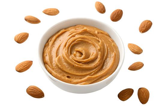 Creamy almond butter in a white bowl surrounded by whole almonds, showcasing a delicious and healthy spread