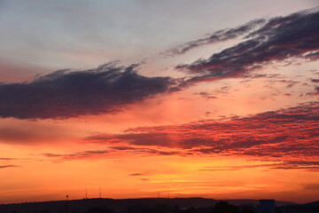 Obraz premium Dramatic Sunset Cloudscape over the city 