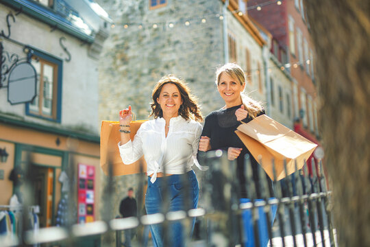 Beautiful senior women outdoors in the city. friends having fun, shopping and bonding
