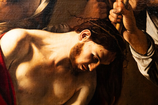 Close-up on painting of Jesus suffering during Via Crucis
