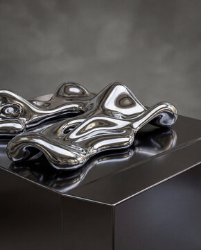 Abstract Chrome Sculptures on a Black Reflective Surface
