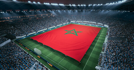 Professional Stadium Soccer Game Championship With Flag of Morocco Spread Across the Pitch Before Football Match Start. Cheering Crowds of Fans Surround the Field. Aerial Wide Shot © Gorodenkoff