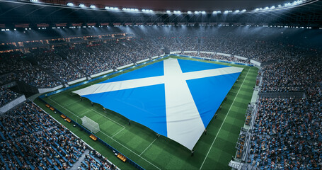 Obraz premium Professional Stadium Soccer Game Championship With Flag of Scotland Spread Across the Pitch Before Football Match Start. Cheering Crowds of Fans Surround the Field. Aerial Wide Shot
