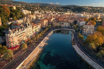 Obraz premium An aerial view showcases the vibrant cityscape of Nice, France, nestled against rolling hills and featuring a picturesque waterfront promenade.