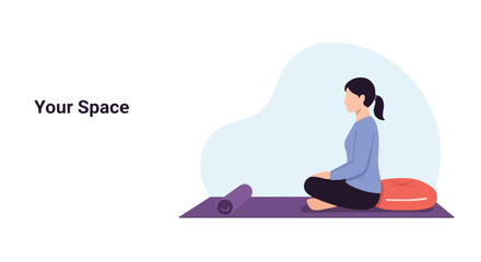 Fototapeta premium A woman sits cross-legged on a yoga mat with a cushion behind her, creating a peaceful personal space for meditation or relaxation.