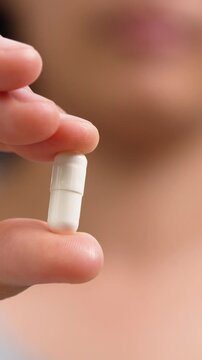 close up woman hand holding a medicine. Stop drug use Taking Medication Caring for the health care medical concept.