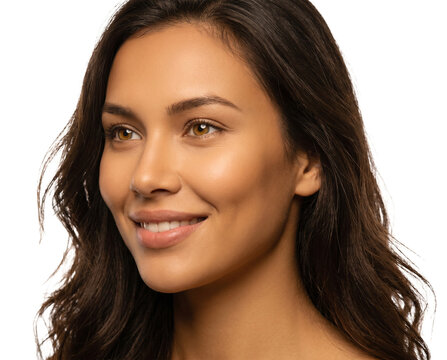 Isolated Woman's face featuring glowing golden-tan complexion, full lips in confident smi