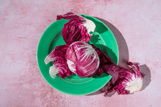 red radicchio cabbage on pink background