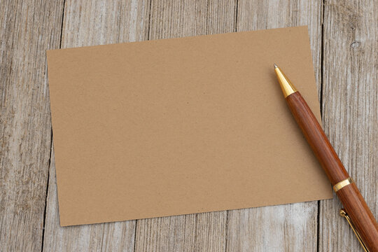 Blank brown card with pen mockup