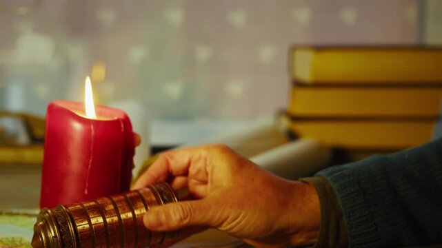 Close-up of hands rotating a cryptex lock in a dim room, surrounded by books and scrolls, suggesting secrecy, research, and unfolding mystery.