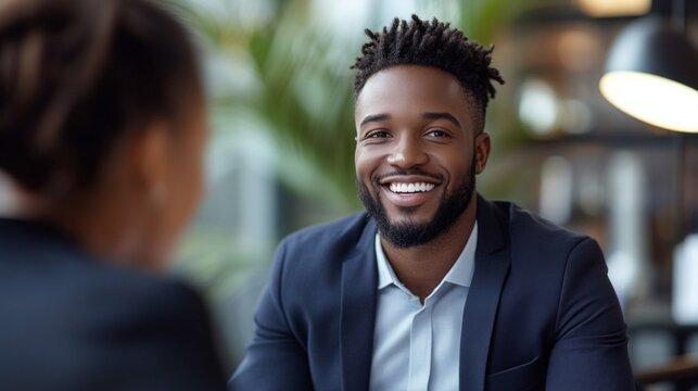A smiling man in a suit provides a positive backdrop for business meetings, interviews and successful communication, radiating friendliness and openness.