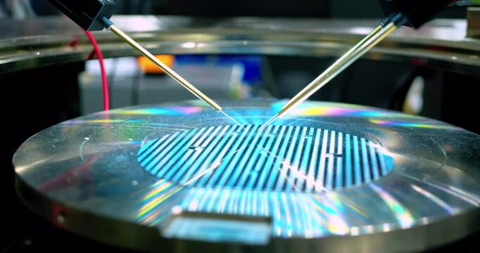 High-precision equipment processing electronic chips placed on a wafer.
