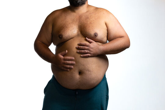 Overweight man holding stomach belly fat