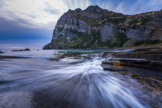 Seongsan Ilchulbong volcanic tuff cone with ocean waves, Jeju Island, South Korea