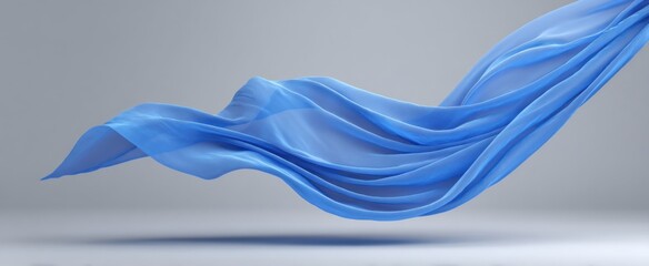 Fototapeta premium Blue chiffon cloth gracefully floats against a light gray background.