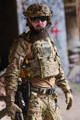 Tactical Soldier In Multicam Gear With Helmet, Plate Carrier And Radio In Urban Environment © .shock