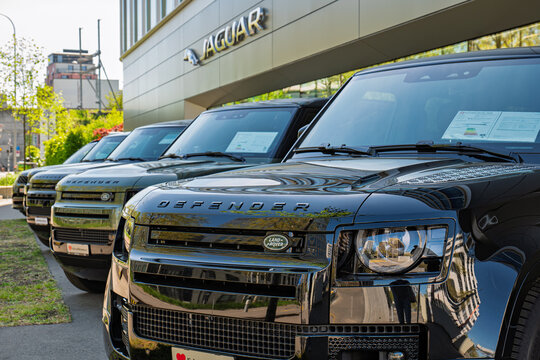Zurich, Switzerland, April 23, 2026. Close up of Land Rover Defender SUVs at Jaguar Land Rover showroom in Zurich North