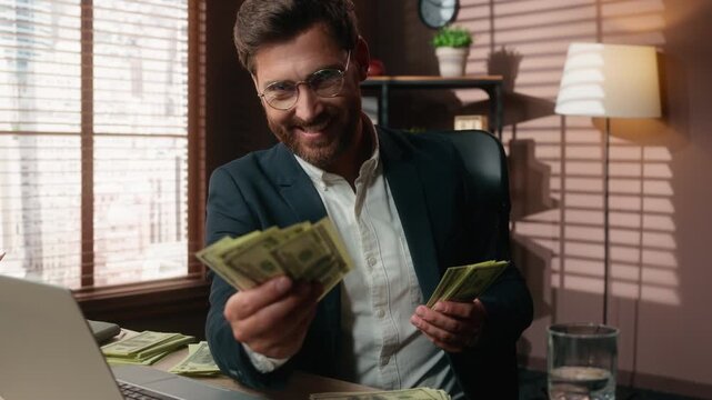 Friendly happy mature Caucasian business man proposing cash offering money looking at camera middle-aged businessman propose dollars male proposal finance trader smile in office financial charity