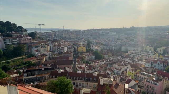 A high resolution panning view from a hill top in downtown  Lisbon Portugal at golden hour.