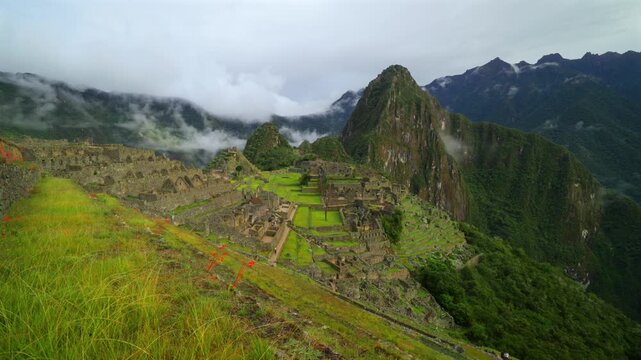 Machu Picchu terrace layers Peru's Inca Temple early morning landscape clouds fog layer Orchid flowers Huayna Picchu Mountain Inca Trail Circuit Peruvian Andres Mountains sanctuary slide left
