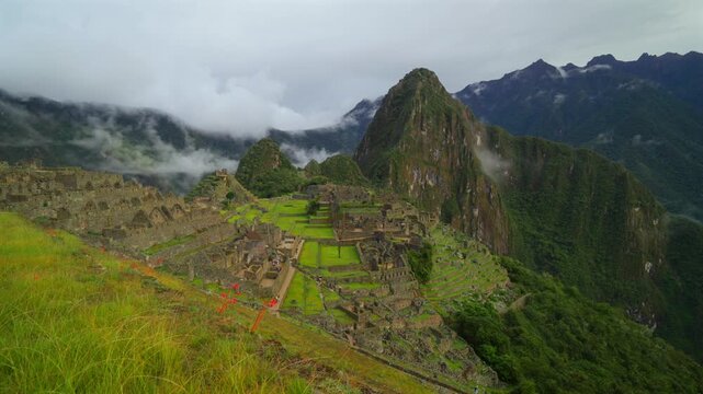Huayna Picchu Mountain landmark Machu Picchu terrace layers Peru's Inca Temple early morning landscape clouds fog layer Orchid flowersInca Trail Circuit Peruvian Andres Mountains sanctuary forward