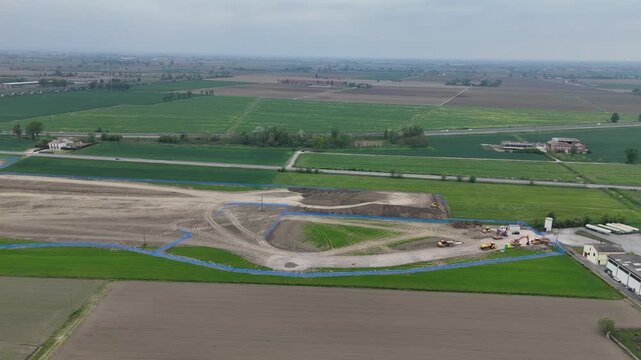 Fiorenzuola Business Park construction site near Fiorenzuola d Arda PC Emilia Romagna Italy showing early stage earthworks and site preparation near A1 and A21 junction and SS9 aerial
